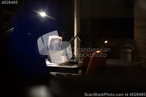 Image of businessman relaxing at the desk