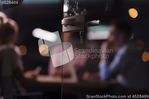 Image of Multiethnic startup business team in night office