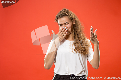 Image of Let me think. Doubtful pensive woman with thoughtful expression making choice against pink background