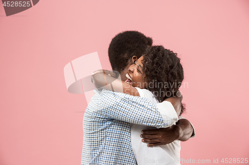 Image of Winning success woman happy ecstatic celebrating being a winner. Dynamic energetic image of female afro model