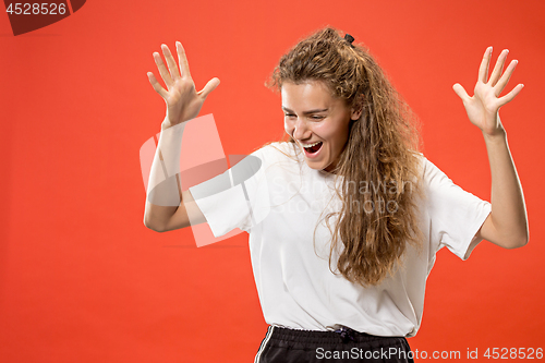 Image of Winning success woman happy ecstatic celebrating being a winner. Dynamic energetic image of female model