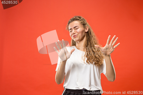 Image of Let me think. Doubtful pensive woman with thoughtful expression making choice against pink background