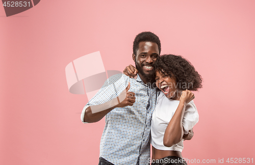 Image of Winning success woman happy ecstatic celebrating being a winner. Dynamic energetic image of female afro model