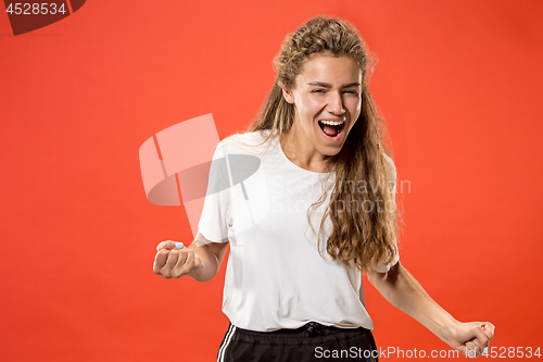 Image of Winning success woman happy ecstatic celebrating being a winner. Dynamic energetic image of female model