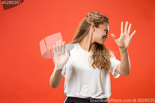 Image of Let me think. Doubtful pensive woman with thoughtful expression making choice against pink background