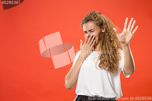 Image of Let me think. Doubtful pensive woman with thoughtful expression making choice against pink background