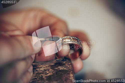 Image of Different goldsmiths tools on the jewelry workplace. Jeweler at work in jewelry.