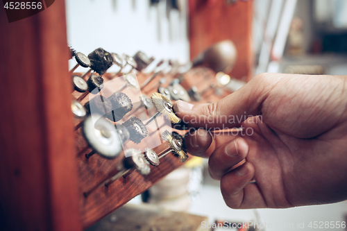 Image of Different goldsmiths tools on the jewelry workplace. Jeweler at work in jewelry.