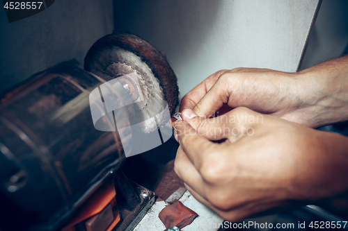 Image of Different goldsmiths tools on the jewelry workplace. Jeweler at work in jewelry.
