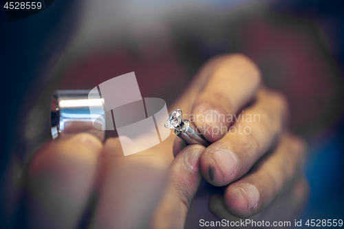 Image of Different goldsmiths tools on the jewelry workplace. Jeweler at work in jewelry.