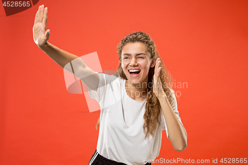 Image of Isolated on pink young casual woman shouting at studio