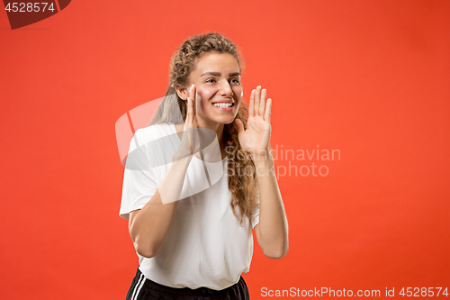 Image of Isolated on pink young casual woman shouting at studio