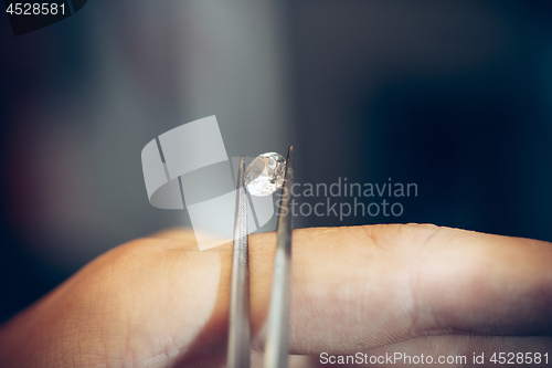 Image of Different goldsmiths tools on the jewelry workplace. Jeweler at work in jewelry.