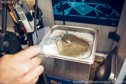 Image of Different goldsmiths tools on the jewelry workplace. Jeweler at work in jewelry.