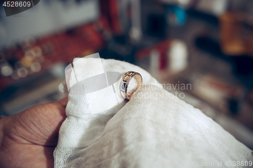 Image of Different goldsmiths tools on the jewelry workplace. Jeweler at work in jewelry.