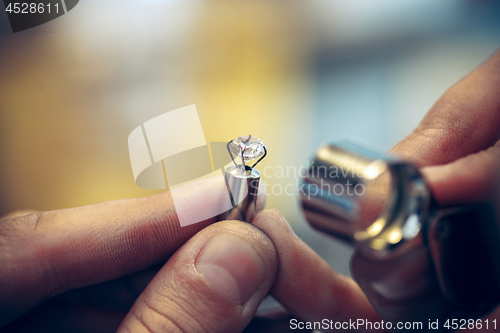 Image of Different goldsmiths tools on the jewelry workplace. Jeweler at work in jewelry.