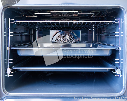 Image of Modern oven with tray inside