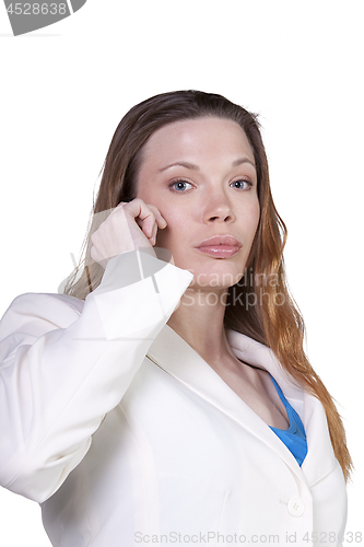 Image of Businesswoman at Talking on the Cell Phone at Work