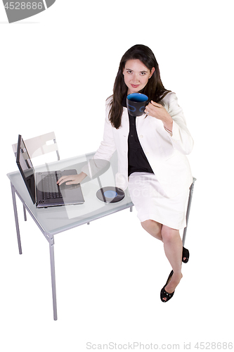 Image of Sexy Woman Sitting on the Desk