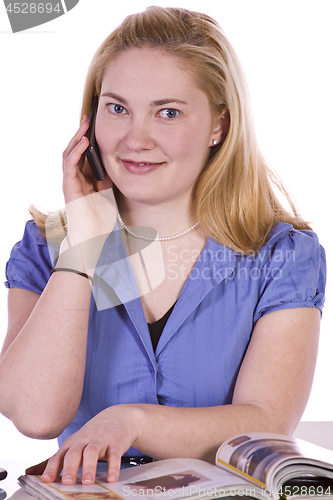 Image of Beautiful Woman Reading a Magazine