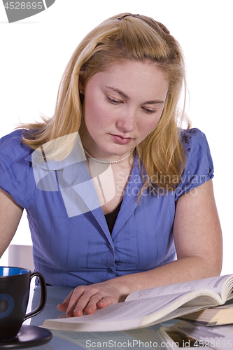 Image of Beautiful Woman Reading a Magazine