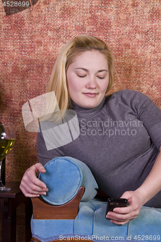 Image of Beautiful Woman Relaxing on the Couch 