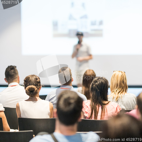 Image of Male business speaker giving a talk at business conference event.