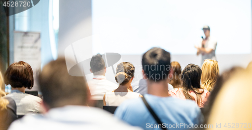 Image of Male business speaker giving a talk at business conference event.