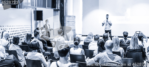 Image of Male business speaker giving a talk at business conference event.