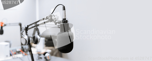 Image of microphone at recording studio or radio station