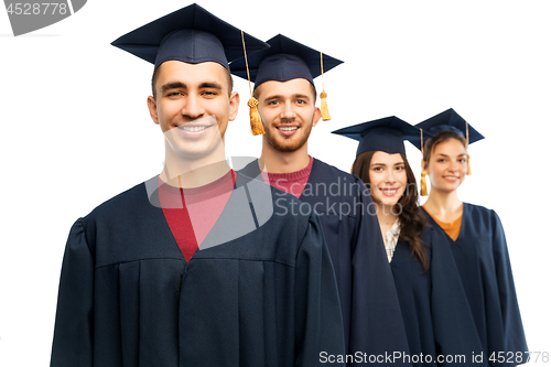 Image of graduates in mortar boards and bachelor gowns