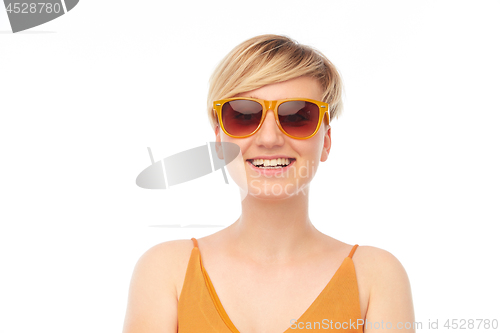Image of portrait of smiling teenage gir in sunglasses