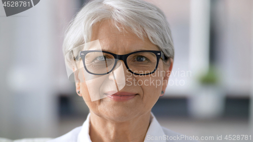 Image of portrait of happy senior woman in glasses