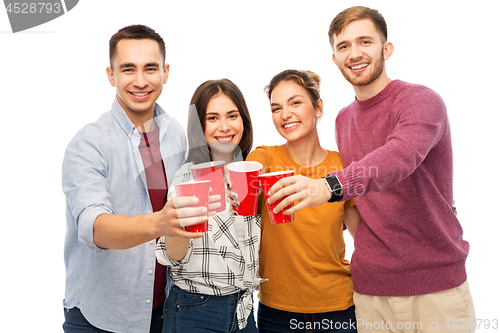 Image of group of smiling friends with drinks in party cups