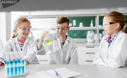 Image of kids with test tubes studying chemistry at school