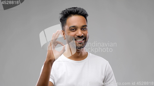Image of happy indian man in t-shirt showing ok hand sign