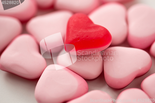 Image of close up of red and pink heart shaped candies