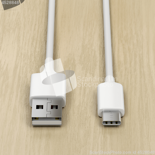 Image of USB cables on wood