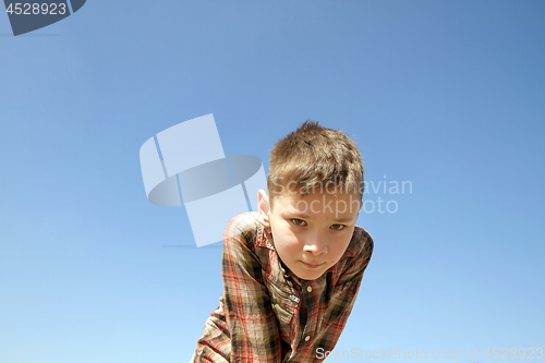 Image of Happy boy play on square