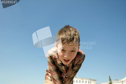 Image of Happy boy play on square