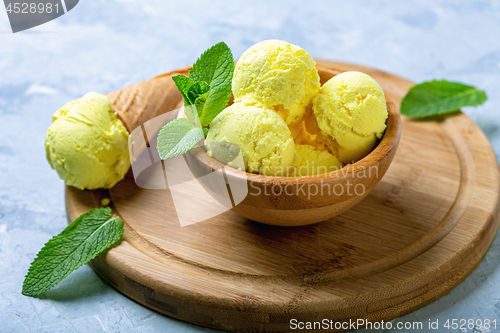 Image of Homemade golden colored turmeric ice cream.