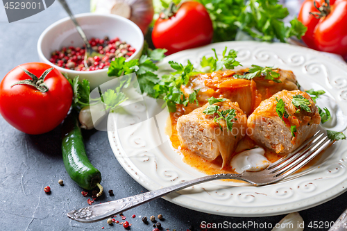 Image of Cabbage rolls with minced meat and sour cream.