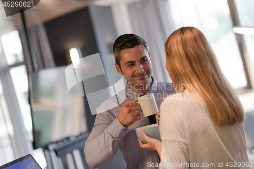 Image of A young couple is preparing for a job and using a laptop