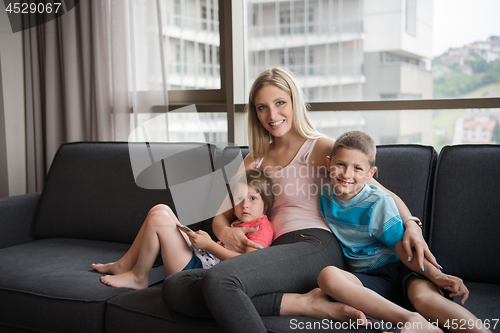 Image of young mother spending time with kids