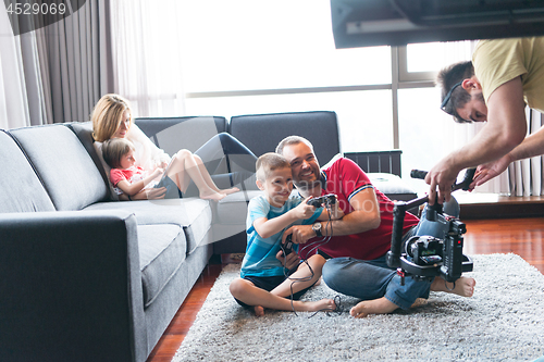 Image of Happy family playing a video game