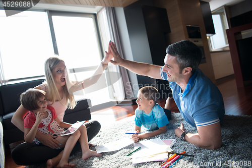 Image of young couple spending time with kids