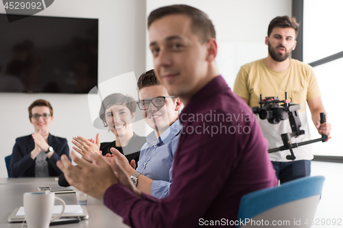 Image of Group of young people meeting in startup office