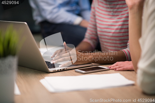 Image of Multiethnic startup business team in night office