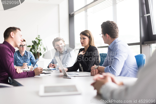 Image of Business Team At A Meeting at modern office building