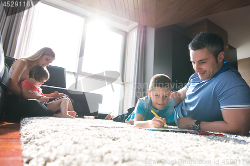 Image of young couple spending time with kids